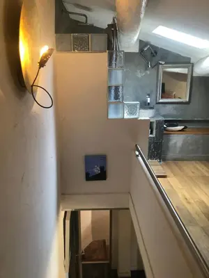 a view of a staircase in a room at AIX Centre LOFT Duplex Terrasse climatisation wifi in Aix-en-Provence