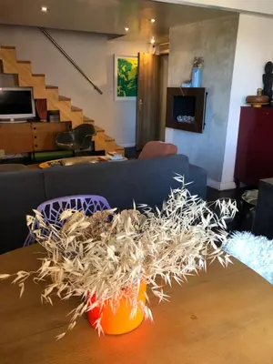 a table with a pile of straw on top of it at AIX Centre LOFT Duplex Terrasse climatisation wifi in Aix-en-Provence