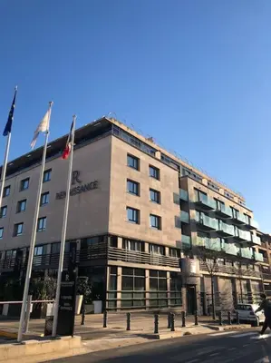 a large building with flags in front of it at ITER House \uc774\ud130 \ud558\uc6b0\uc2a4 in Aix-en-Provence