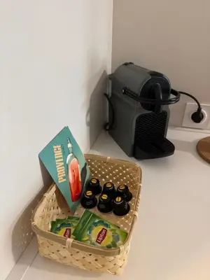 a basket of food and a toaster on a counter at 014 Studio Provençal - Proche d'Aix en Provence in Éguilles