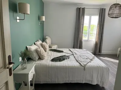 a bedroom with a bed and a window at Mas Provençale entre Avignon et St Remy de Provence in Noves