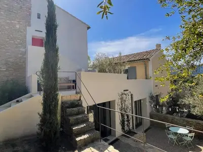 a stairway leading to a white house at Villa luxueuse à Ménerbes + piscine in Ménerbes