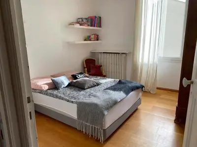 a bedroom with a bed with two pillows on it at Villa élégante à Cavaillon avec piscine in Cavaillon