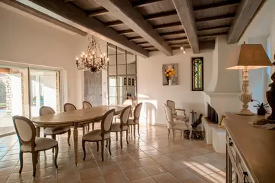 a dining room with a table and chairs at La maison de Inna in Bonnieux