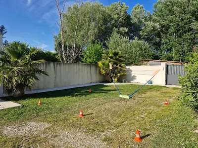a yard with orange cones in the grass at Maison avec piscine privée, sauna et activités - Rendez-vous en Provence in Althen-des-Paluds