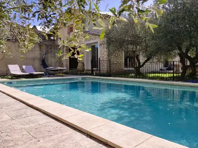 a swimming pool in front of a house at Maison avec piscine privée, sauna et activités - Rendez-vous en Provence in Althen-des-Paluds
