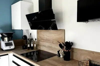 a kitchen with a counter top with a microwave at Chez Céline - Belle maison climatisée piscine in Carpentras