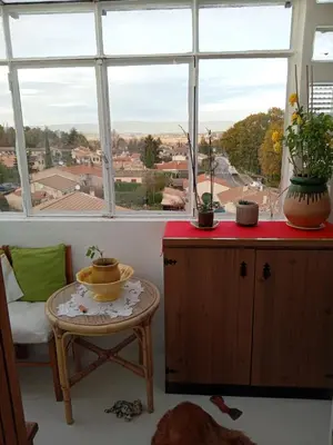 a room with a table and a window with plants on it at T3 campagne Aix-en-Provence in Meyrargues