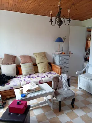 a living room with a couch and a table at T3 campagne Aix-en-Provence in Meyrargues