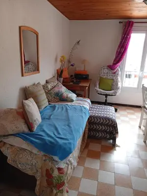 a bedroom with a bed and a desk and a chair at T3 campagne Aix-en-Provence in Meyrargues
