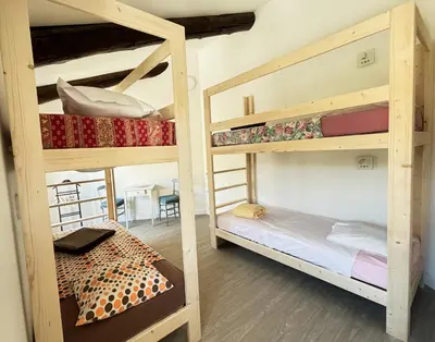 a room with bunk beds in a hostel at Gîte de l'Escanson un temps pour soi in Robion en Luberon
