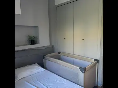 a bedroom with a tub and a bed in it at Lou Karo - Piscine partagée - Parking privé in Gordes