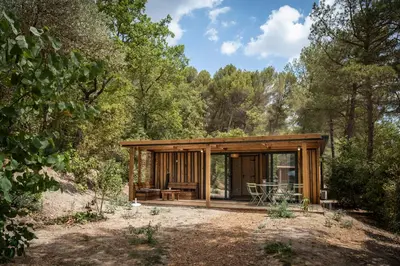a log cabin in the woods with trees at Citykamp d'Aix-en-Provence in Aix-en-Provence