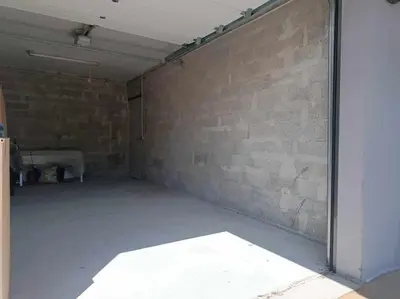 an empty room with a brick wall at Sérénité au fil de l'eau Appartement de standing in LʼIsle-sur-la-Sorgue