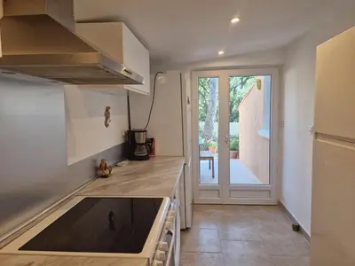 a kitchen with a sink and a counter top at la Cigalière in LʼIsle-sur-la-Sorgue