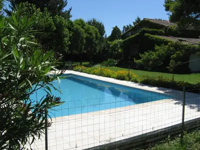 a swimming pool in the yard of a house at Clos Sainte-Garde in Saint-Didier