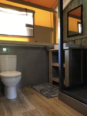 a bathroom with a toilet and a sink at La Grisonne Chalet 1 in Revest-du-Bion