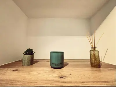 three vases sitting on top of a wooden table at Appartement à la campagne in LʼIsle-sur-la-Sorgue