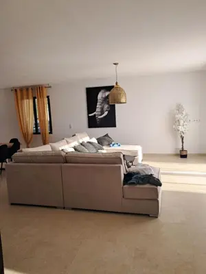 a living room with a couch and a table at Villa SOFIA in Saint-Saturnin-les-Apt