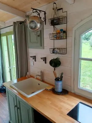 a kitchen with a sink and a counter top at Roulotte Karlotte in Pernes-les-Fontaines