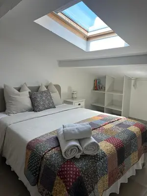 a bedroom with a bed with towels on it at Magnifique villa familiale avec piscine in Caumont-sur-Durance