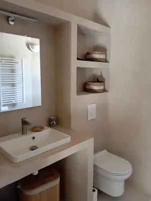 a bathroom with a sink and a toilet at Maison de campagne La Teranga au coeur du Luberon in Apt