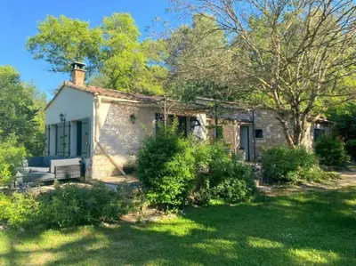 an old stone house in the middle of a yard at Mazet avec piscine, vue Ventoux in Crillon-le-Brave