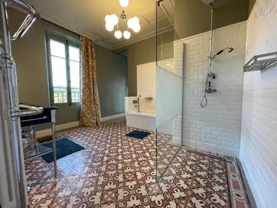 a bathroom with a shower with a glass door at La palasse in Le Thor
