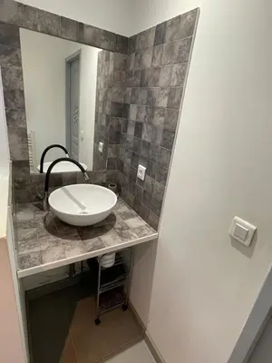 a bathroom with a sink and a mirror at Studio charmant avec terrasse in Lançon-Provence