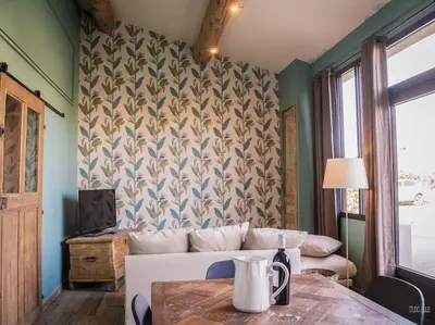a living room with a couch and a table at Charmant T1 calme et reposant in Saint-Andiol