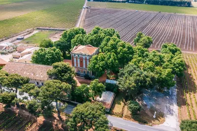 an aerial view of a house with trees and a road at Château la Beaumetane in Lançon-Provence