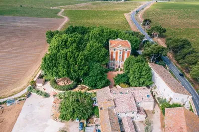 an overhead view of a house with trees and a field at Château la Beaumetane in Lançon-Provence