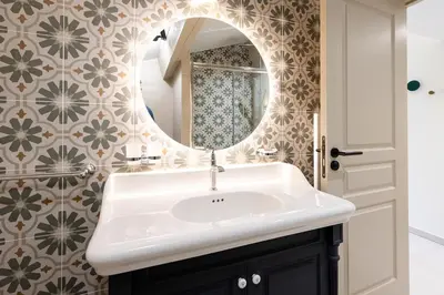 a bathroom with a sink and a mirror at Château la Beaumetane in Lançon-Provence