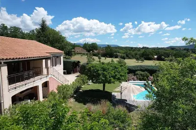 an aerial view of a house with a swimming pool at Air-conditioned house in the Luberon with heated swimming pool in Saint Saturnin les Apt - 8 people. in Saint-Saturnin-les-Apt