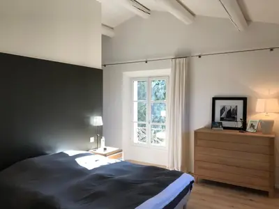 a desk with a computer and a chair in a room at Mas provencal XIXème siécle avec piscine in Aix-en-Provence