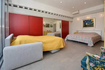 a hotel room with two beds and a couch at St REMY AILLEURS in Noves