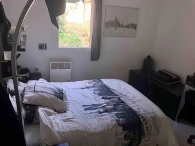 a bedroom with a bed and a window at Villa provençale entre Aix en Provence et Luberon in Rognes