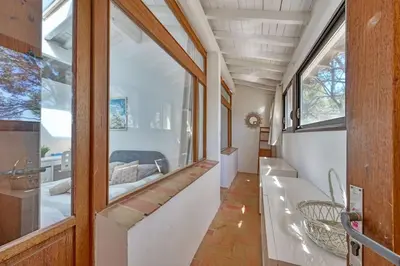 a bathroom with a tub and a large window at Grande villa avec piscine près d'Avignon - Jonquerettes in Jonquerettes