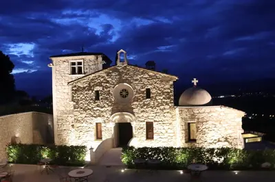 a stone church at night with a dark sky at Domaine Jourdan in Le Puy-Sainte-Réparade