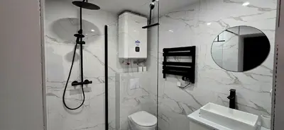 a bathroom with a shower and a sink and a mirror at Pic chic in Châteaurenard