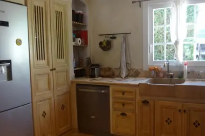 a kitchen with a sink and a window at Maison avec piscine au calme au pied du Ventoux in Mazan