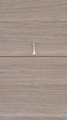 a wooden box with a number one on it at Le jardin des oliviers in Apt