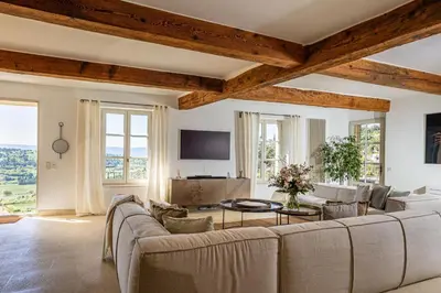a living room with a couch and a table at Vue Dexception Gordes in Gordes