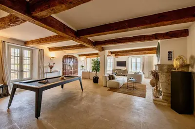 a living room with a pool table in the middle at Vue Dexception Gordes in Gordes