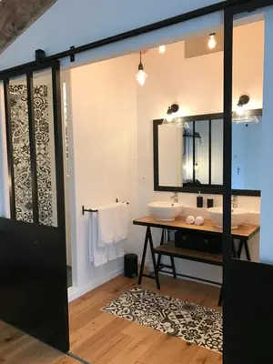 a bathroom with a sink and a mirror at Le Cabanon de Marie in Saignon