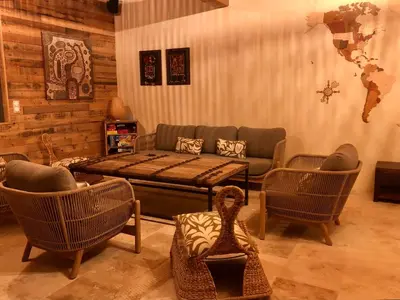 a living room with a couch and chairs at L'Oustalet des Alpilles in Saint-Rémy-de-Provence