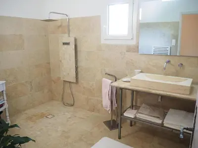a bathroom with a sink and a mirror at Holiday Home in Villes-sur-Auzon with Pool in Villes-sur-Auzon