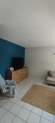 a living room with a flat screen tv and a couch at Chez Kristina in Entraigues-sur-la-Sorgue