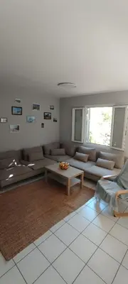 a living room with a couch and a coffee table at Chez Kristina in Entraigues-sur-la-Sorgue