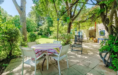a table and chairs sitting on a patio at Cozy Home In Aix-En-Provence With Wifi in Aix-en-Provence